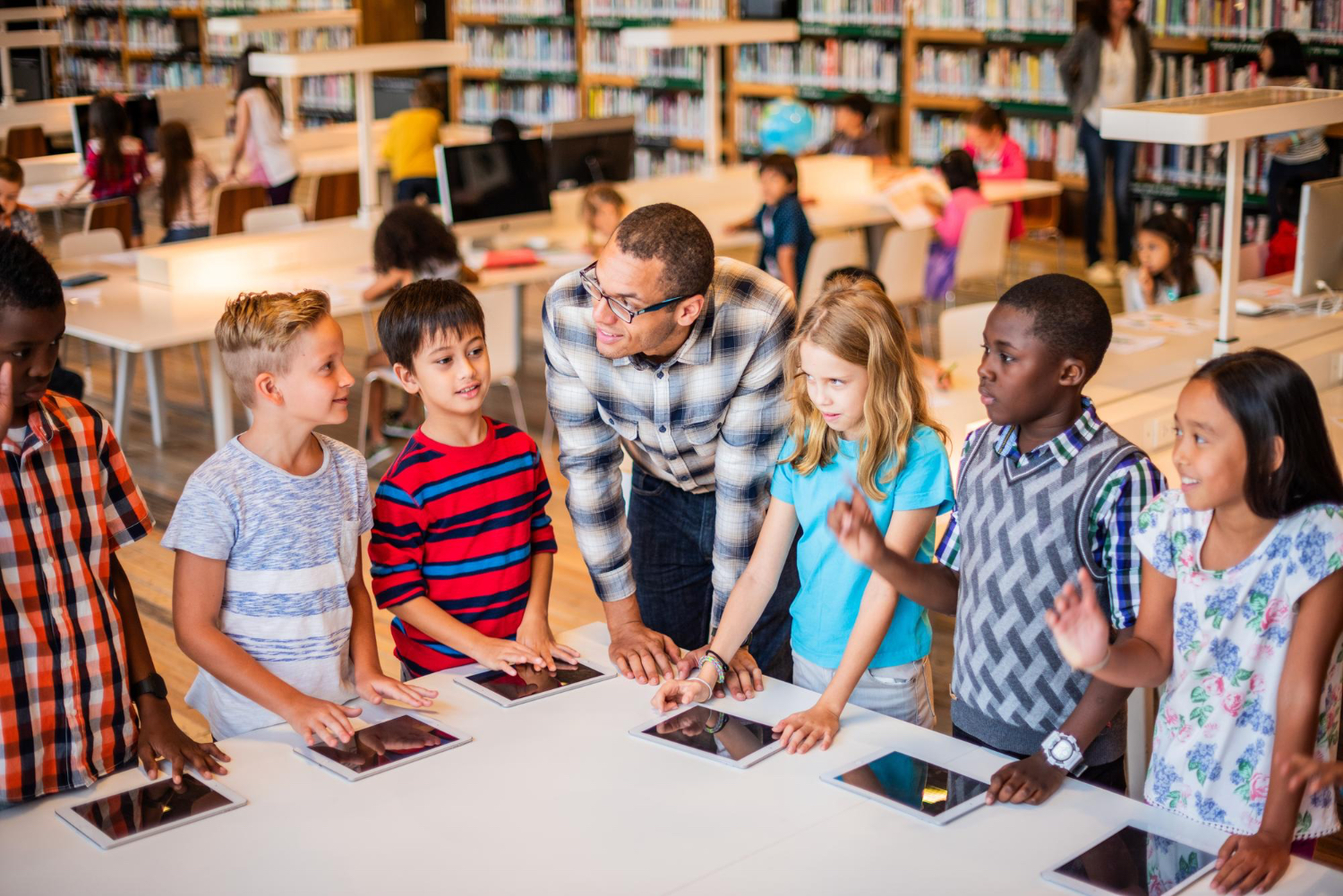 Students using tablets together